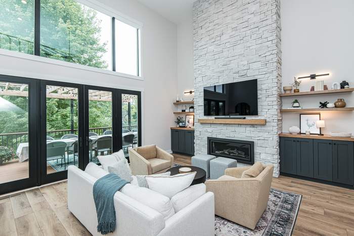 The Kapler — Living room with rebuilt stone fireplace