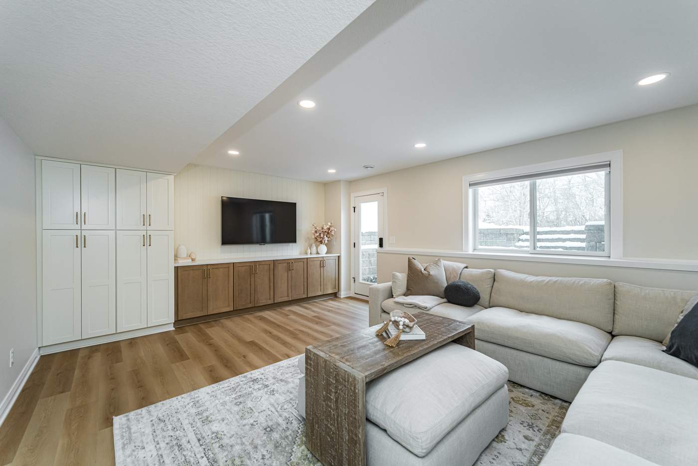 The Overland — finished basement by MN Living Co. in Rochester, MN: family room