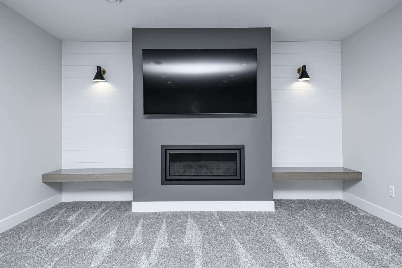 The Slate — finished basement by MN Living Co. in Rochester, MN: fireplace feature wall